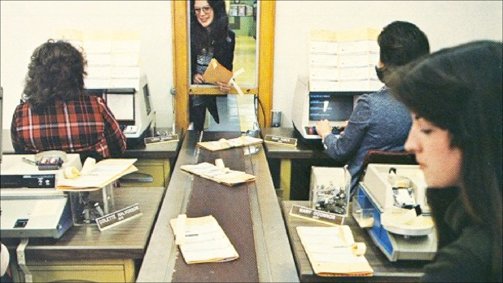 A group of Deluxers working at a plant in the 1970s