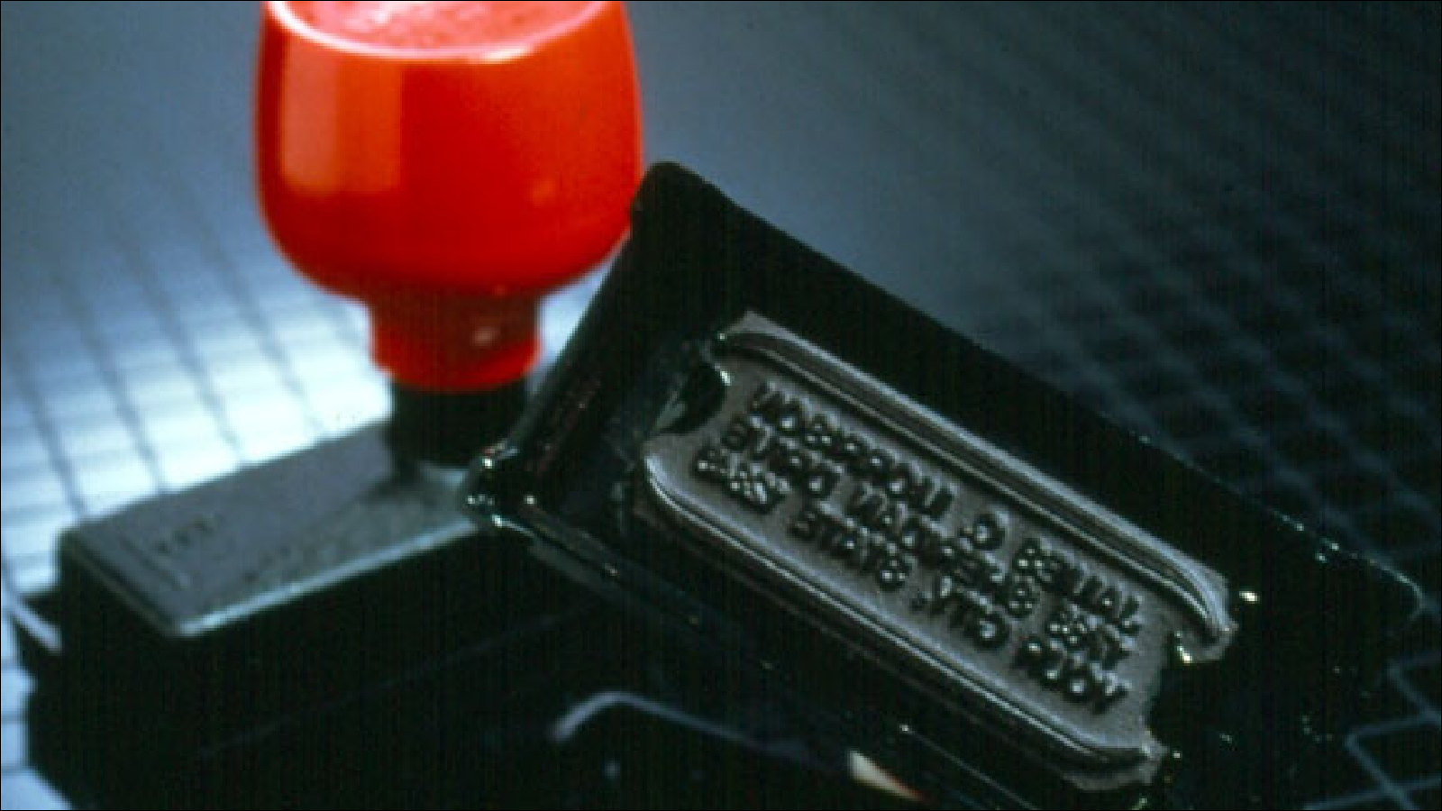 A pre-inked endorsement stamp produced by Deluxe